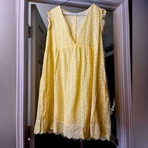 New without tags but never worn. Cute dress with shorts underneath and pockets.